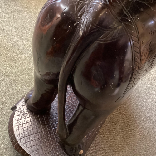 298 - Anglo Indian hardwood occasional table, with carved elephant base, 72cm High