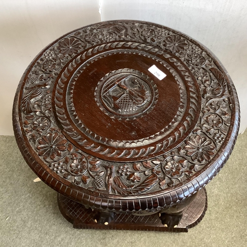 298 - Anglo Indian hardwood occasional table, with carved elephant base, 72cm High