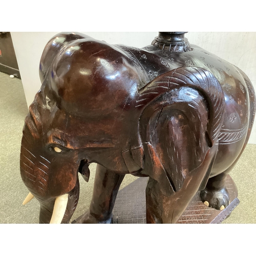 298 - Anglo Indian hardwood occasional table, with carved elephant base, 72cm High