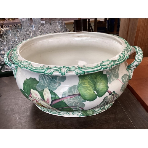 318 - A quantity of large china bowls and planters, etc to include  a large green and white two handled, a... 