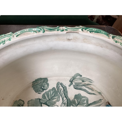 318 - A quantity of large china bowls and planters, etc to include  a large green and white two handled, a... 