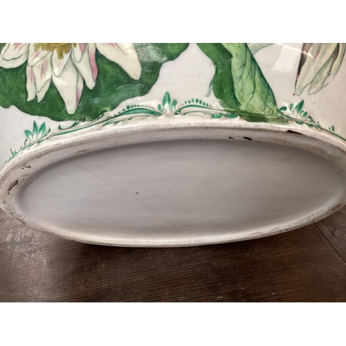 318 - A quantity of large china bowls and planters, etc to include  a large green and white two handled, a... 