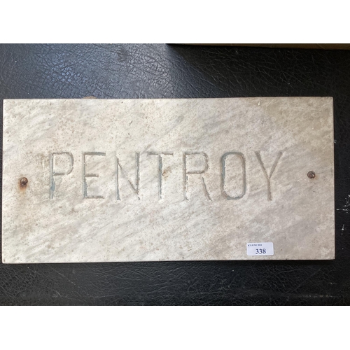 338 - A rectangular composite stone plaque carved PENTROY 27cm x 48cm.