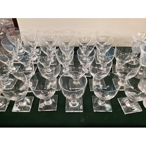 346 - A large collection of glassware to include a set of 4 Biot irradescent wine glasses, etc