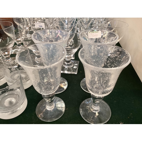 346 - A large collection of glassware to include a set of 4 Biot irradescent wine glasses, etc