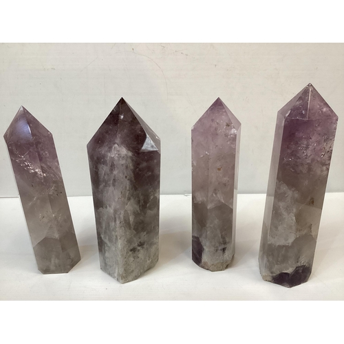 357 - Four amethyst quartz carved crystals, largest 27cm H