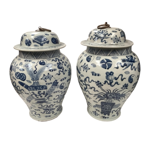 361 - A pair of oriental style baluster shaped lidded jars, with metal loop handles, 42cm H