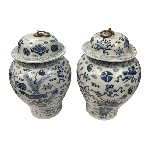 361 - A pair of oriental style baluster shaped lidded jars, with metal loop handles, 42cm H