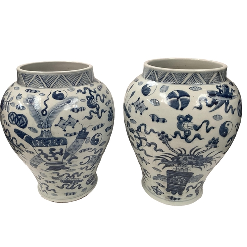 361 - A pair of oriental style baluster shaped lidded jars, with metal loop handles, 42cm H