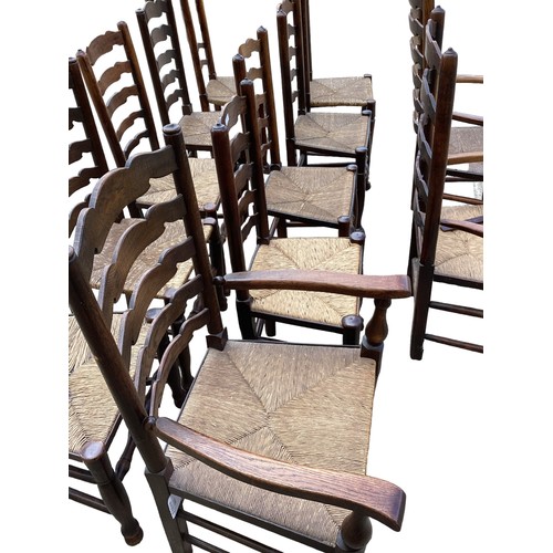 617 - A harlequin set of 12 elm ladder back dining chairs with rush seats.(12)