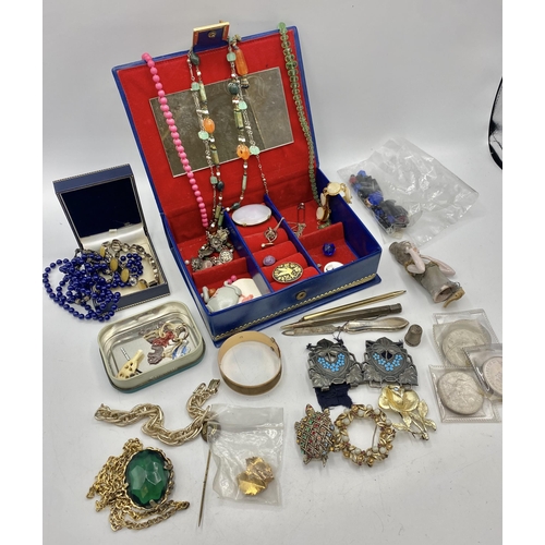 137 - A collection of costume jewellery to include an Arts and Crafts pewter and turquoise enamel belt buc... 