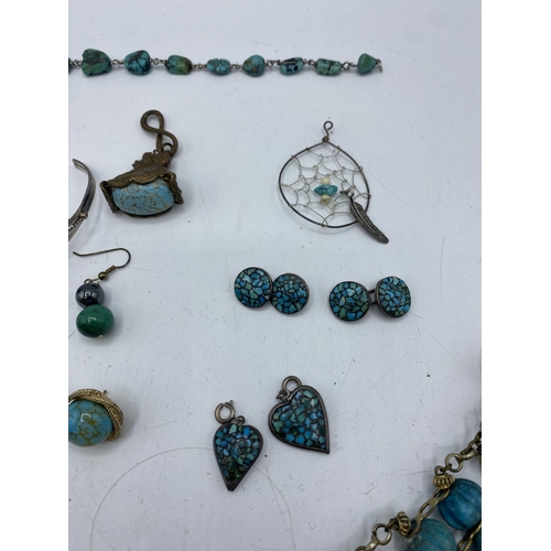 181 - A collection of silver and white metal turquoise and synthetic turquoise set jewellery.