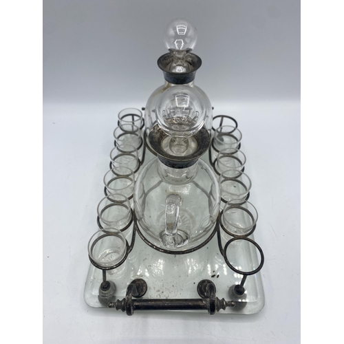 266 - A late 19th century glass and white metal liqueur companion. Glass and white metal tray with white m... 