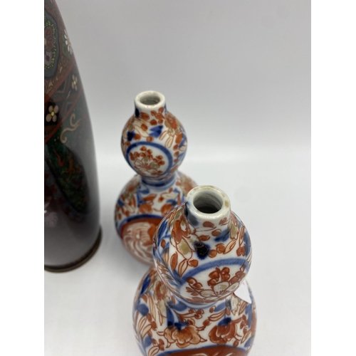 272 - A Cloisonné vase together with a pair of Imari double gourd vases. 25cm(h) 15cm(h)