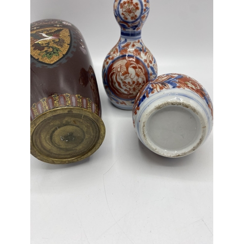 272 - A Cloisonné vase together with a pair of Imari double gourd vases. 25cm(h) 15cm(h)