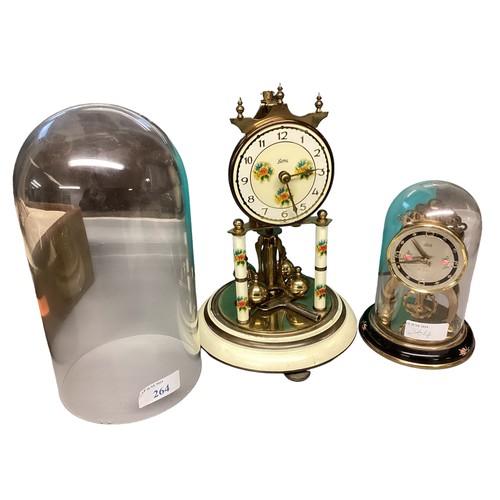 264 - Two 20th century brass skeleton clocks in glass domes with stands. 25cm(h) 15cm(h)