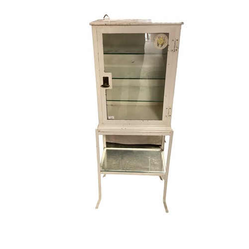 611 - Steel and glass fronted medicine cabinet on stand