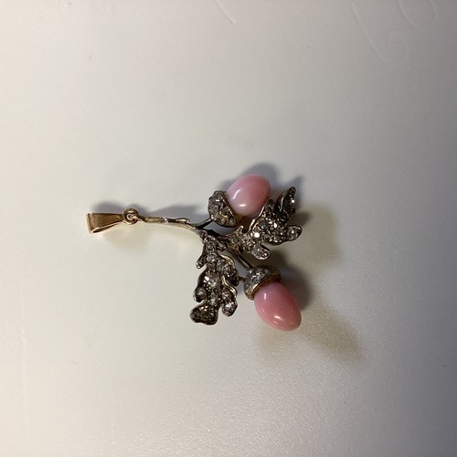 2 - A Conch pearl and  diamond oak leaf design pendant in an unmarked yellow and white metal mount. Each... 
