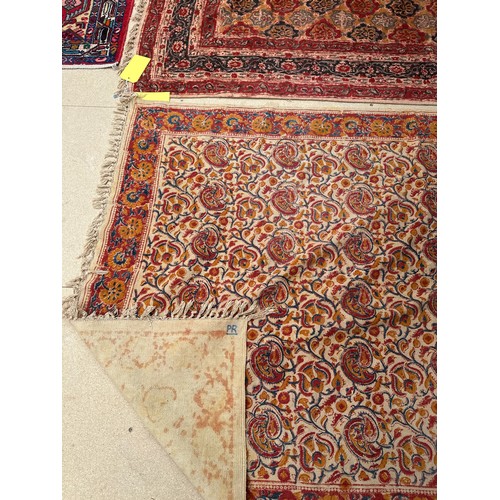 513 - Two rugs: Red rug with a blue borders 150 cm x 208 and beige rug with orange , red and blue borders ... 