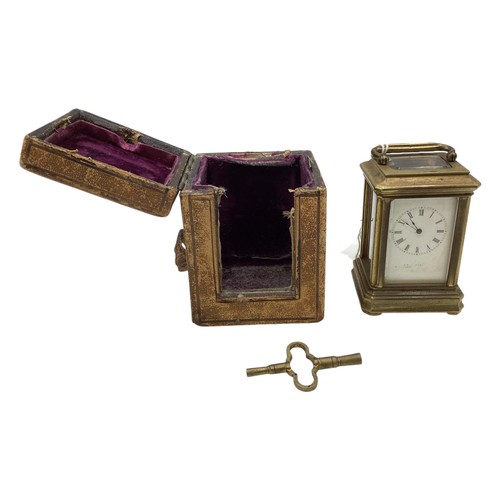 110 - A miniature brass carriage clock in original velvet lined case. With numbered movement 2051. 7cm (h)... 