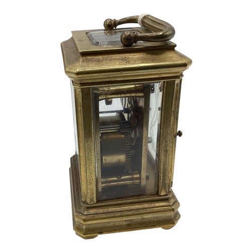 110 - A miniature brass carriage clock in original velvet lined case. With numbered movement 2051. 7cm (h)... 