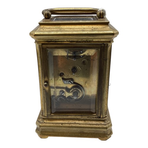 110 - A miniature brass carriage clock in original velvet lined case. With numbered movement 2051. 7cm (h)... 