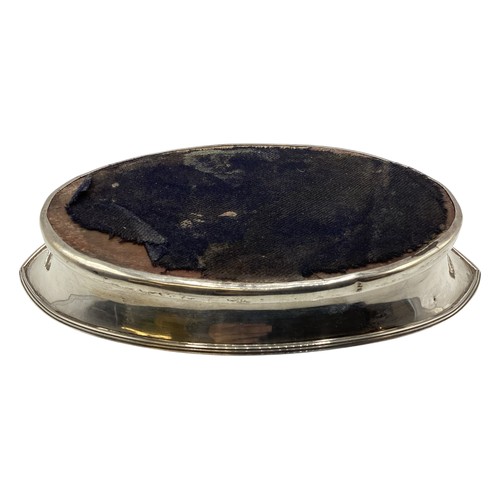 99 - A sterling silver oval coaster or stand with wooden base, Chester 1910. Together with a sterling sil... 