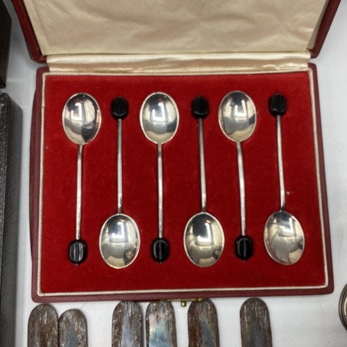 73 - A collection of sterling silver and white metal items to include a boxed set of coffee spoons with b... 