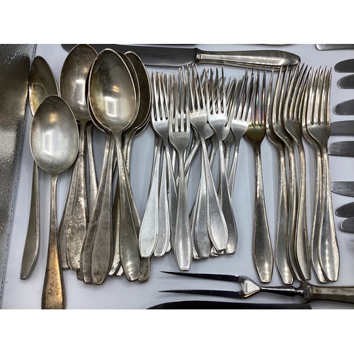 88 - A set of continental 800 silver flatware together with matching silver handled cutlery. Hallmarked w... 