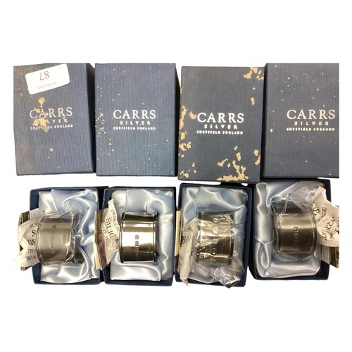 87 - A set of six individually boxed sterling silver napkin rings by Carr's of Sheffield. Total 166g. Tog... 