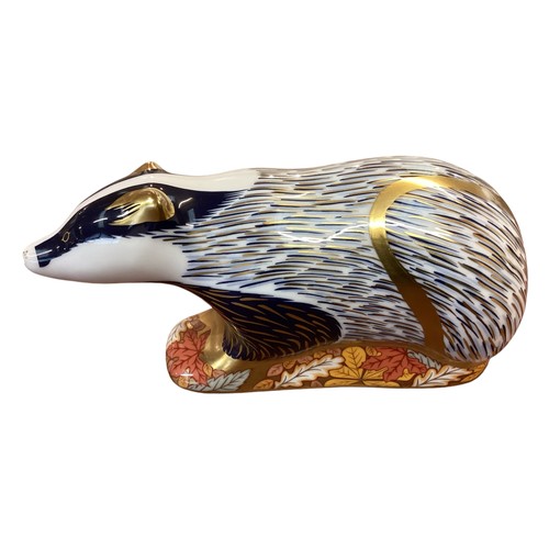 441 - Four Royal Crown Debry models of Badgers of differing designs, to include woodland badger moonlight ... 