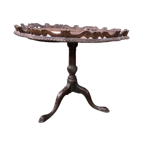 619 - Georgian mahogany, snap top, circular pedestal table with carved gallery raised on a serpentine carv... 