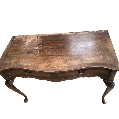 620 - Cross banded walnut serpentine fronted sidetable.  Condition and wear see photos.  121 cm W x 58 cm ... 