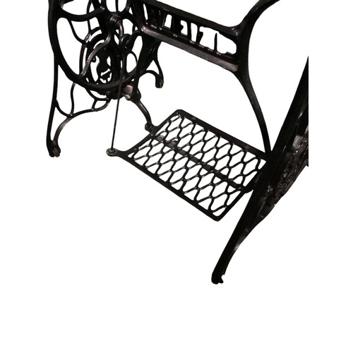 542 - A SINGER treadle sewing machine table, 68cm Wide