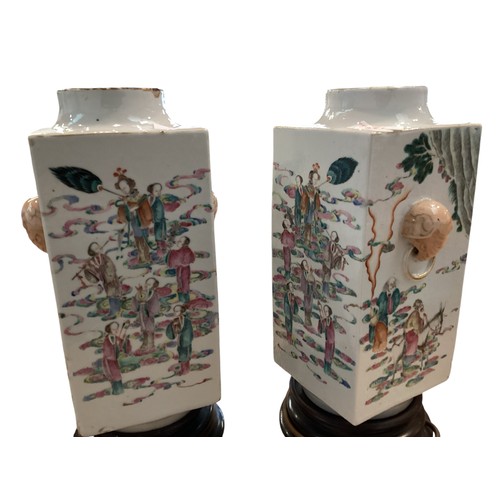 381 - A pair of Oriental Famille Rose style square vases converted to lamps on turned wooden bases. . 35cm