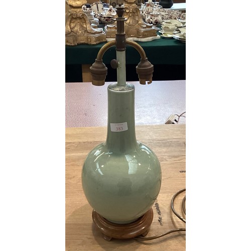 383 - A Celadon style vase on turned wooden stand. 33cm(h)