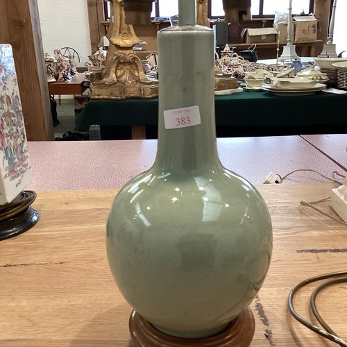 383 - A Celadon style vase on turned wooden stand. 33cm(h)