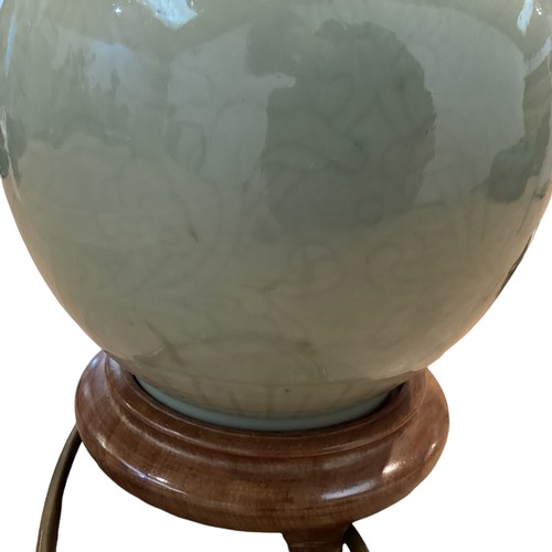 383 - A Celadon style vase on turned wooden stand. 33cm(h)