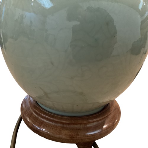 383 - A Celadon style vase on turned wooden stand. 33cm(h)