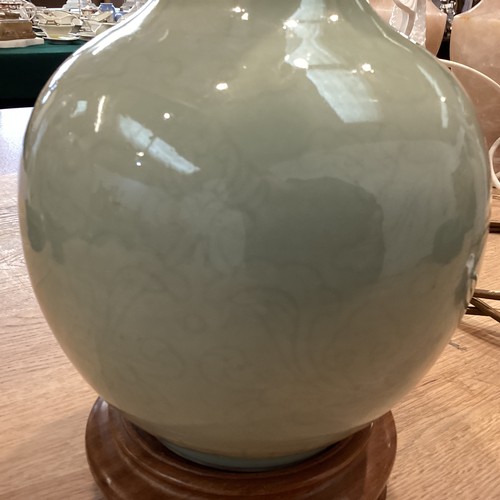 383 - A Celadon style vase on turned wooden stand. 33cm(h)