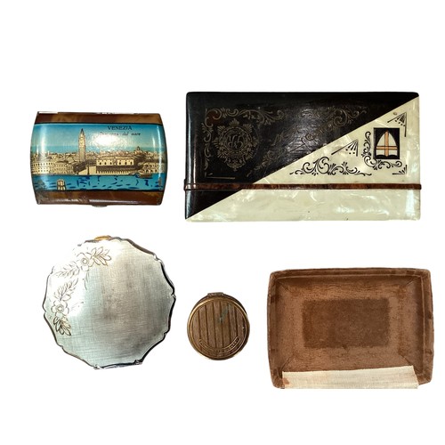 392 - A collection of compacts and cigarette cases to include an unmarked white metal engine turned exampl... 