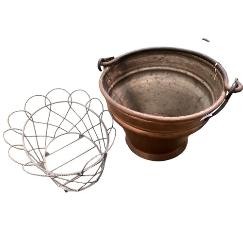 402 - A collection of metal ware to include a copper pale, fireplace tools, copper pot with iron handle, e... 