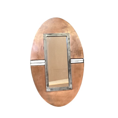 401 - A Secessionist style oval copper wall mirror. 60cm x 38cm and a rectangular modern wall mirror; and ... 