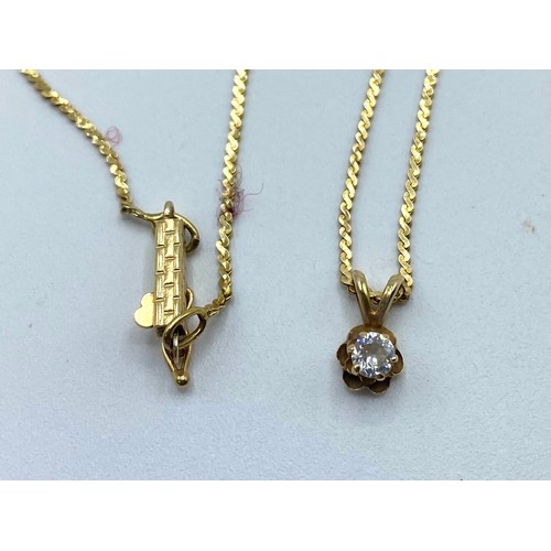 41 - A 14ct gold flat fancy link necklace with brilliant cut diamond pendant un unmarked yellow metal mou... 