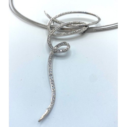 49 - An 18ct white gold multi strand necklace with integral abstract diamond set pendant, 15.4 g