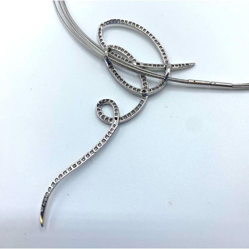 49 - An 18ct white gold multi strand necklace with integral abstract diamond set pendant, 15.4 g