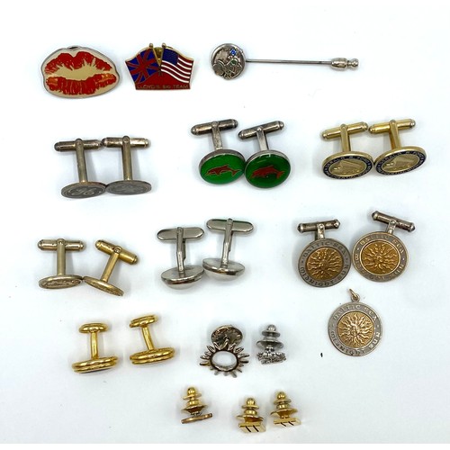 54 - A collection of yellow and white metal cufflinks, tie pins and lapel badges together with a pair of ... 