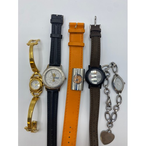 55 - A collection of high street and fashion watches to include a yellow metal Gucci example and other ma... 