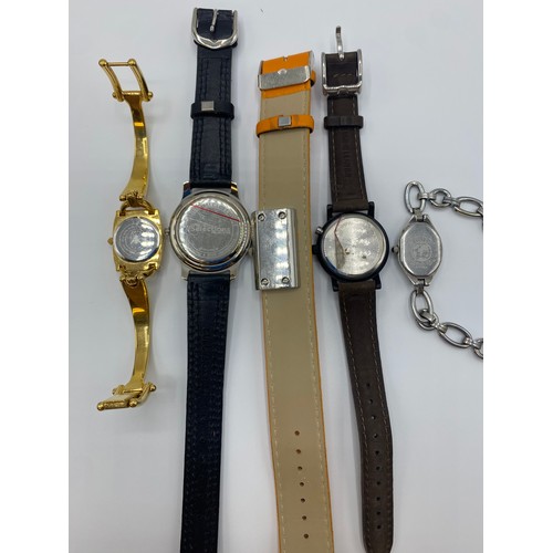 55 - A collection of high street and fashion watches to include a yellow metal Gucci example and other ma... 