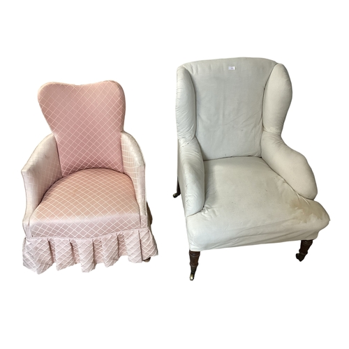 583 - Howard style arm chair on mahogany legs and brass castors, in calico and a small pink armchair